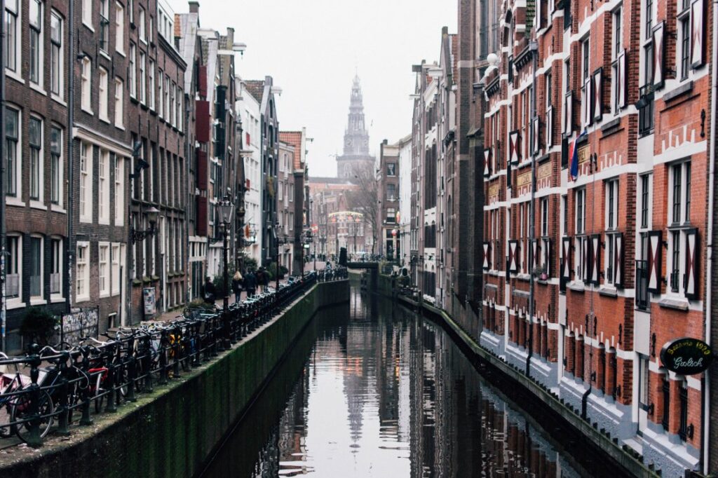 Historic Amsterdam canal representing urban OSP telecommunication and FTTH network projects.